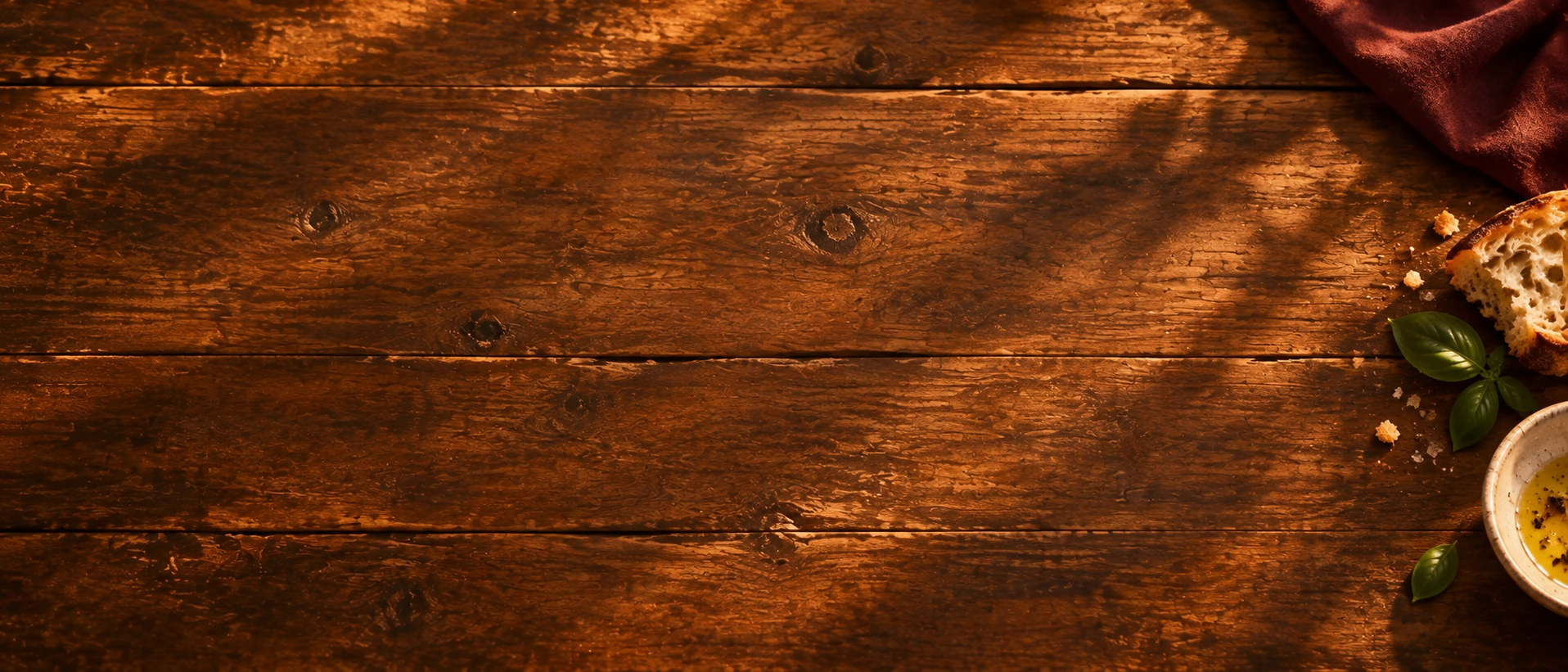 An inviting overhead view of a shared restaurant table. Low-detail section background or divider.