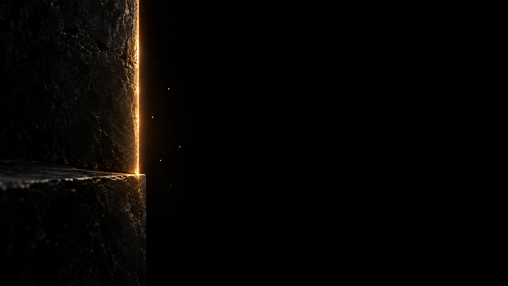 A hair-thin warm amber seam of light along the right edge of two nearly invisible black stone planes, three or four tiny airborne glints.