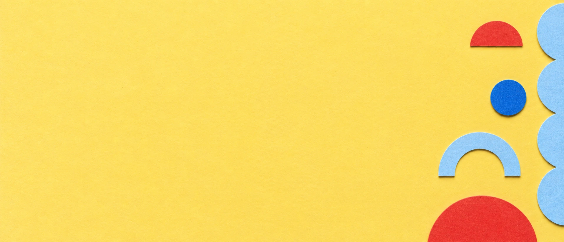 Playful paper forms with a warm butter-yellow palette. Alternate hero with copy on left.