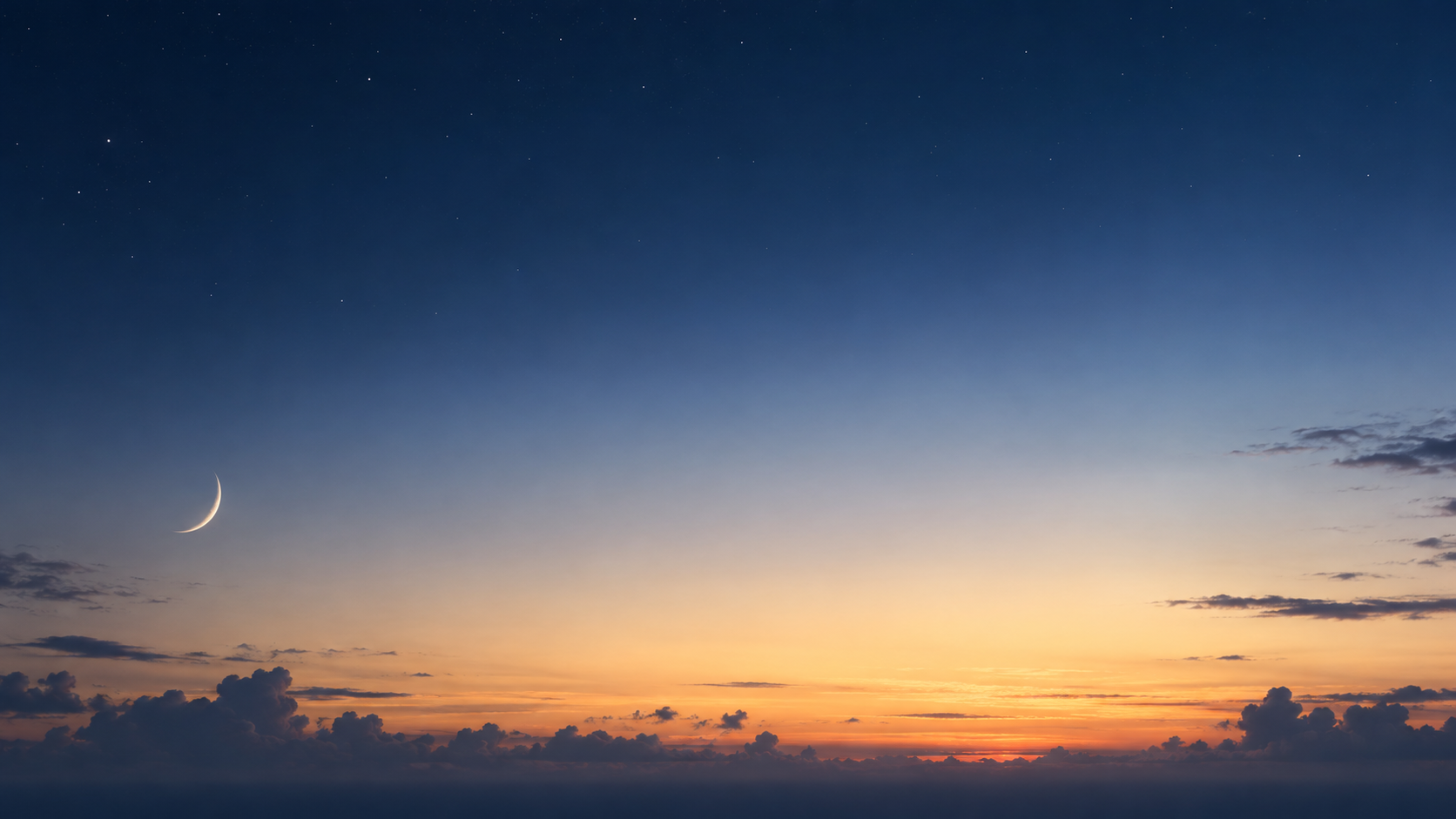 A slim crescent moon low over a smooth pale apricot dawn horizon, tiny dark cloud silhouettes confined to the bottom.