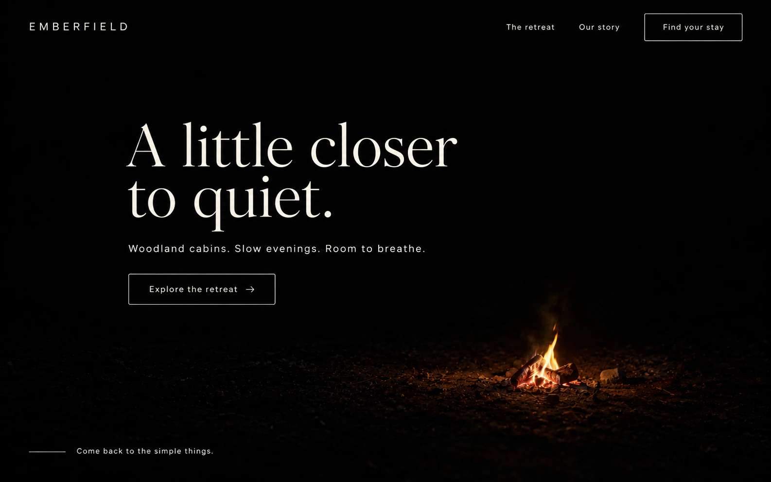 Emberfield woodland retreat website concept with ivory editorial typography and a small distant campfire against near-black night.