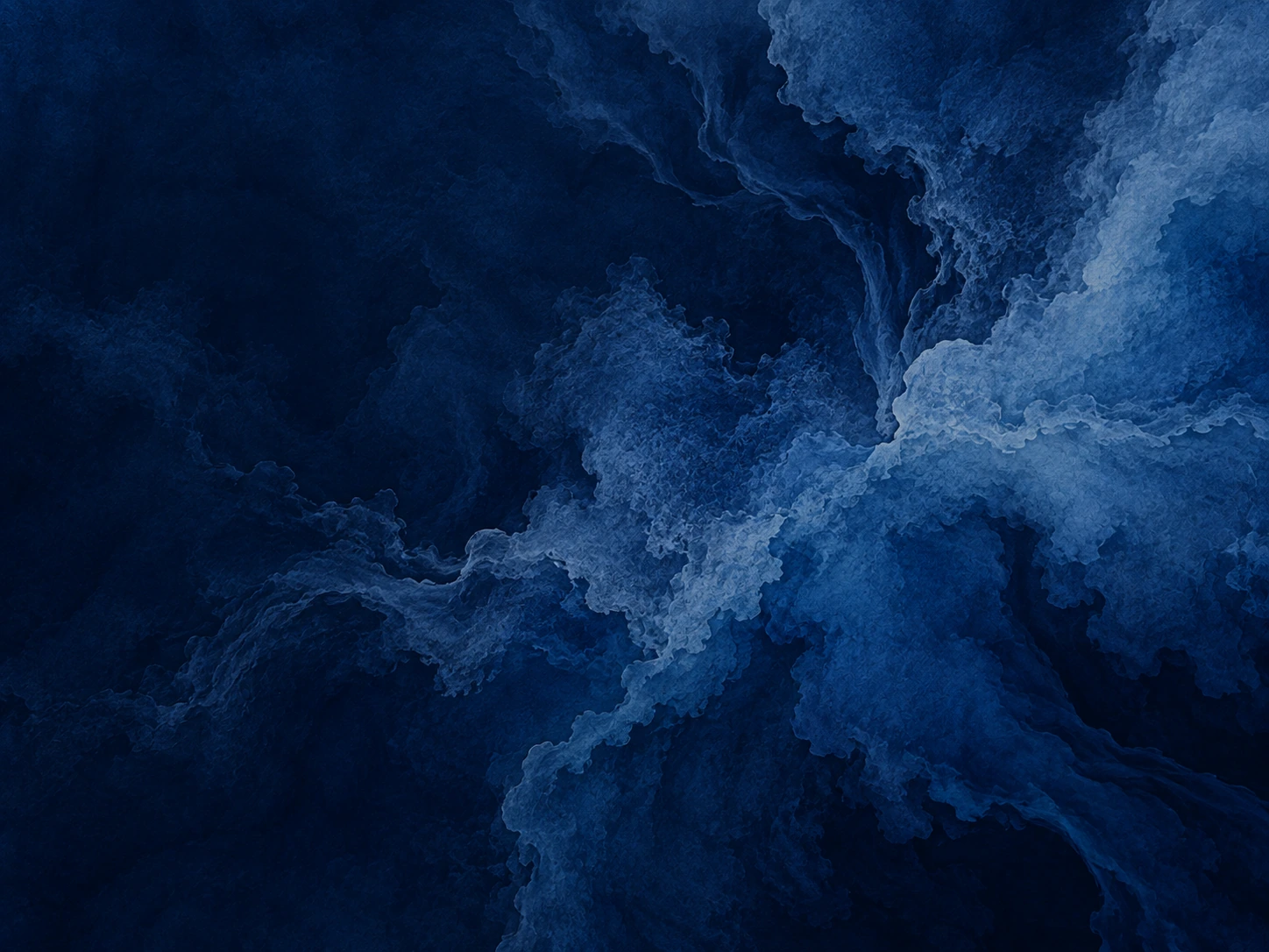 Deep indigo washes flowing like ink through water. Detail image beside feature or story text.