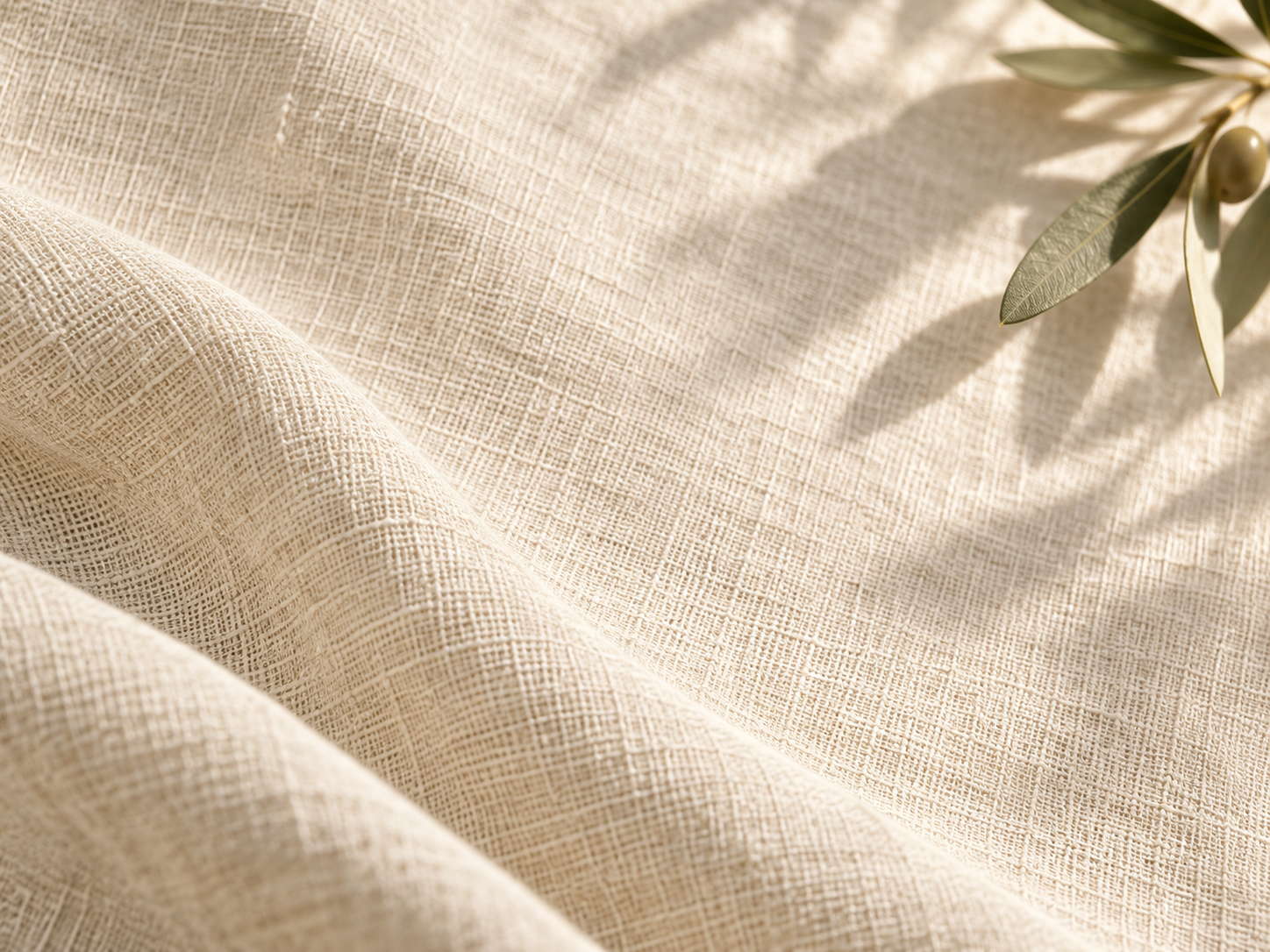 Soft linen folds and gentle olive morning light. Close detail for feature section.