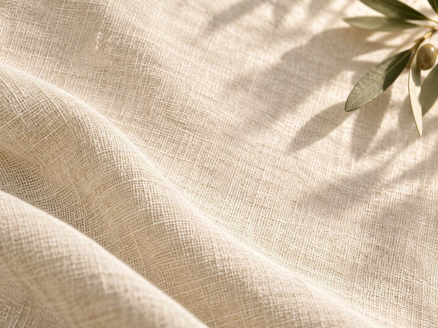 Soft linen folds and gentle olive morning light. Close detail for feature section.