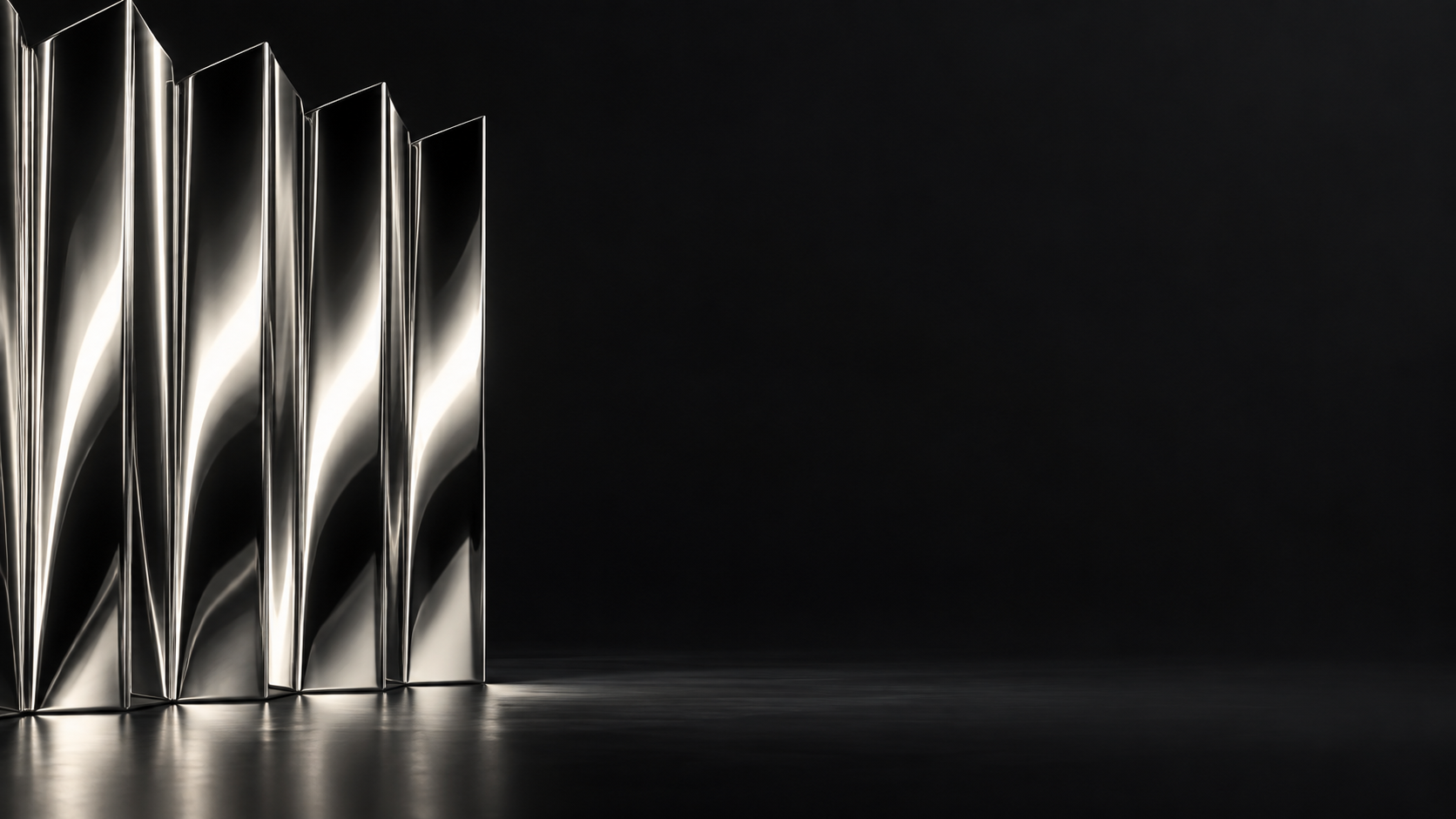 An accordion-folded sheet of mirror-polished silver stands along the left edge, rhythmic narrow highlights on black.