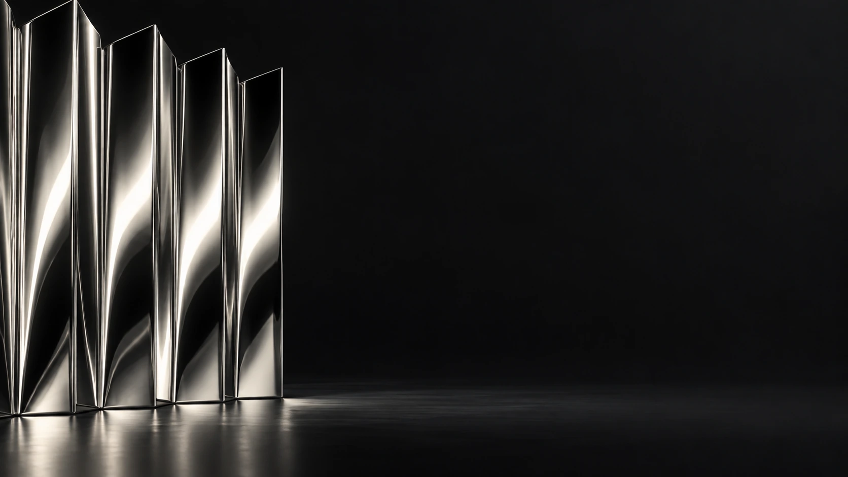 An accordion-folded sheet of mirror-polished silver stands along the left edge, rhythmic narrow highlights on black.