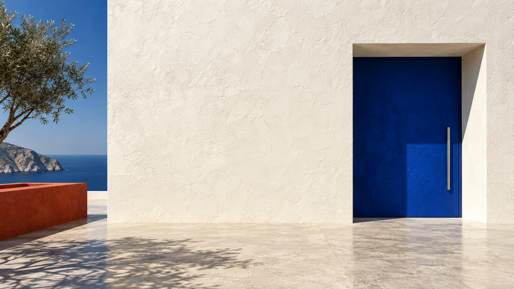 A single ultramarine square doorway in a chalk-white monolithic wall, deeply recessed, right aligned, midday shadow.