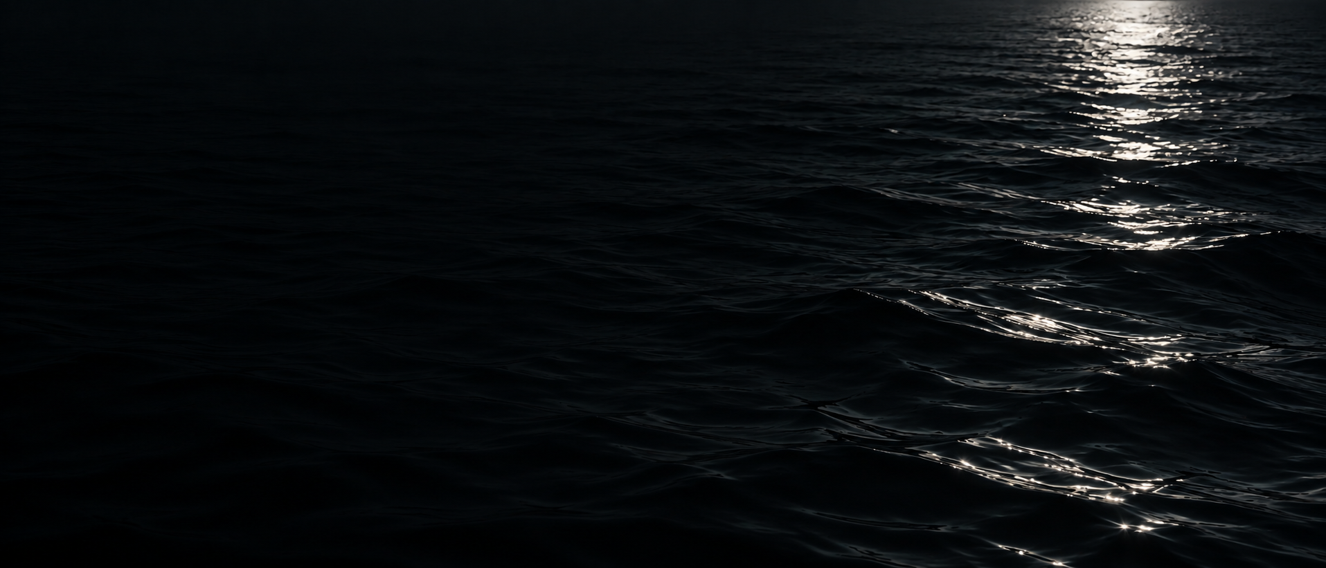 Silver moonlight falling across deep, still water. Darker section background.