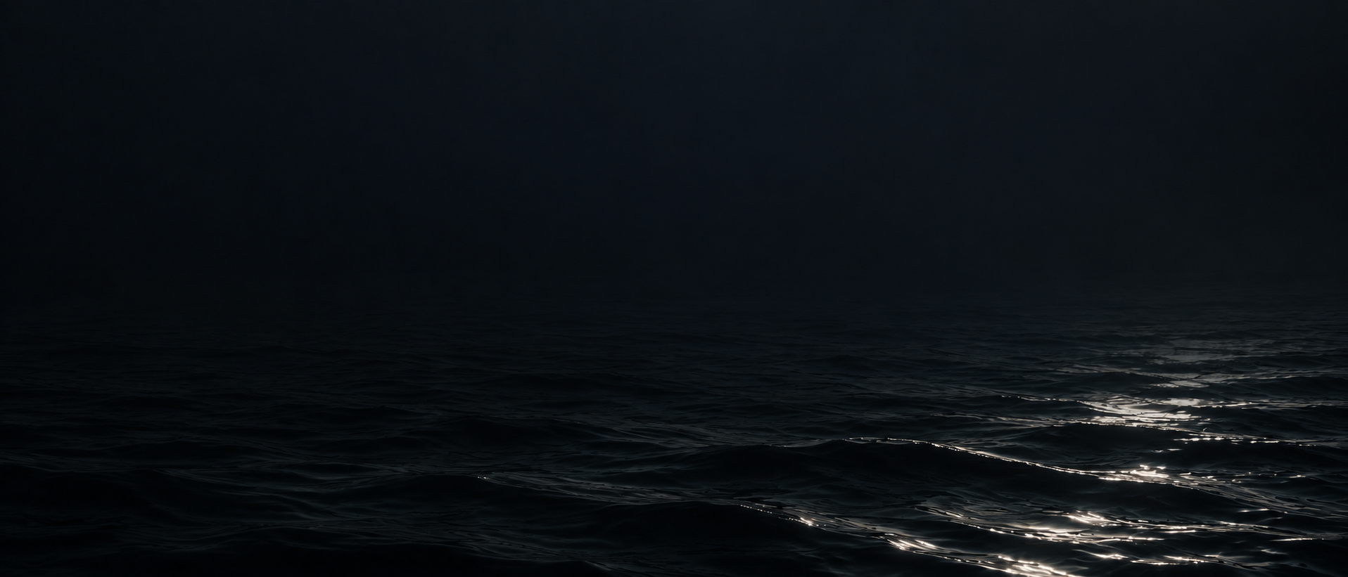 Silver moonlight falling across deep, still water. Quiet divider or quote background.