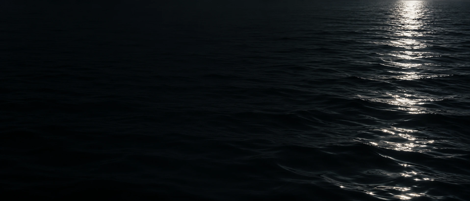 Silver moonlight falling across deep, still water. Main background.