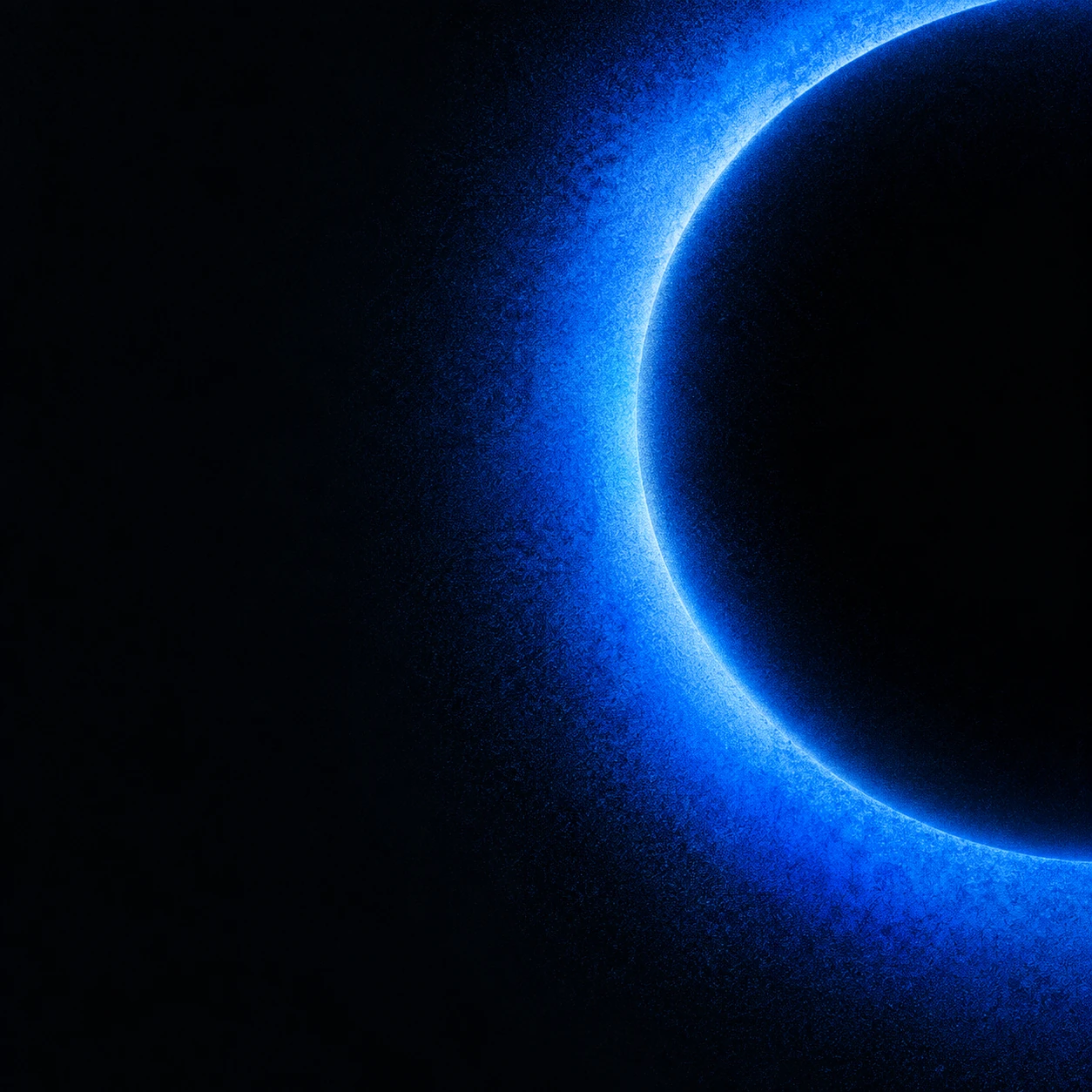 A grainy cobalt ring cropped against a black square canvas.