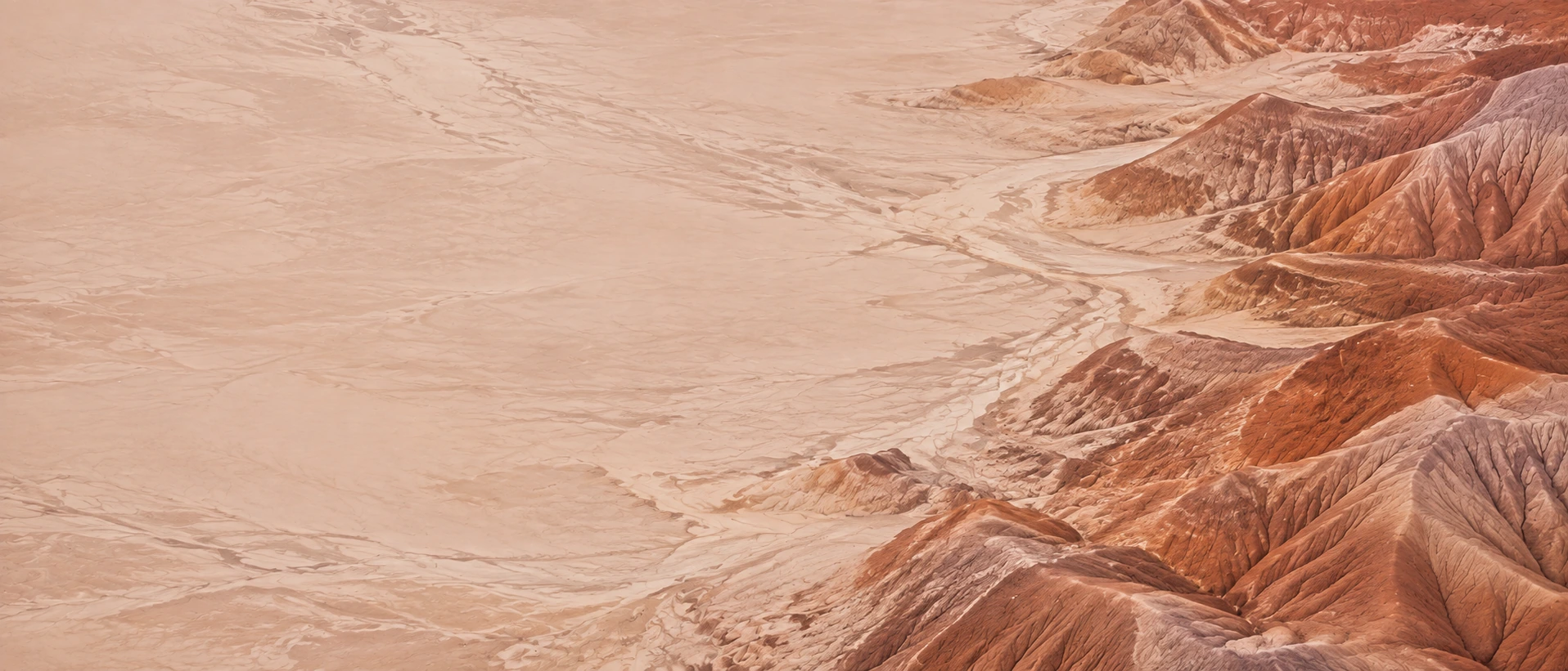 Sculpted desert lines and warm terracotta earth. Alternate hero with copy on left.