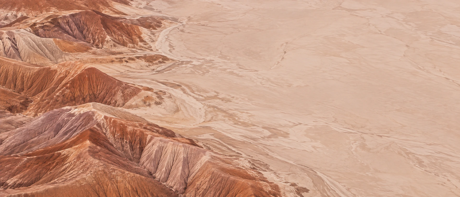 Sculpted desert lines and warm terracotta earth. Alternate hero with copy on right.