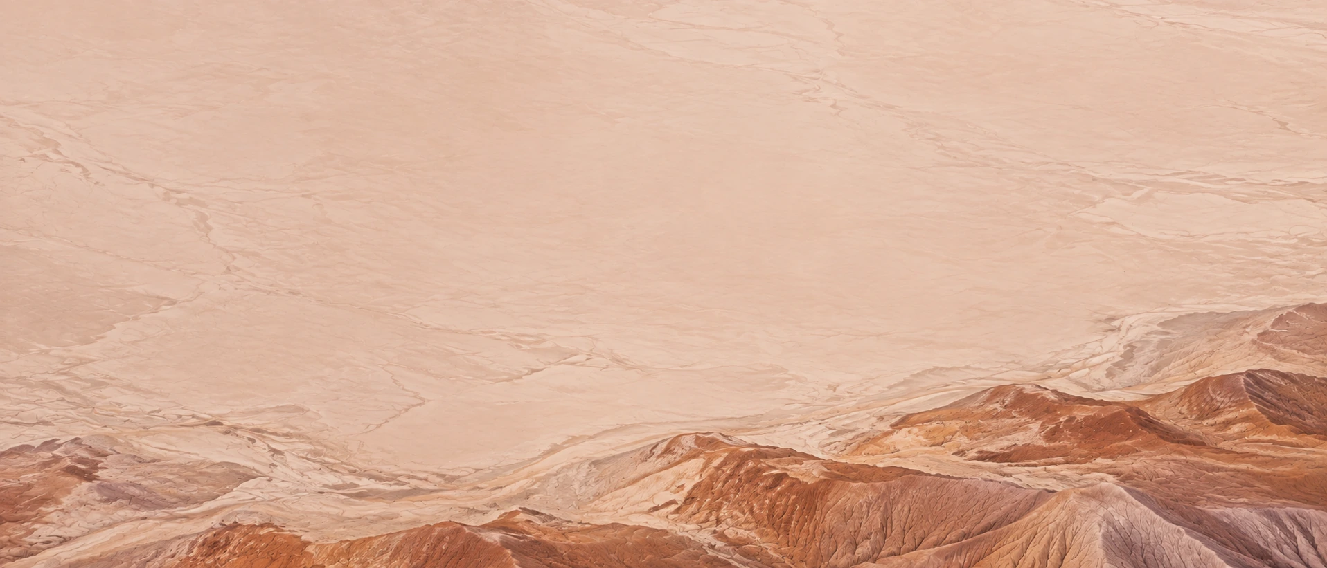Sculpted desert lines and warm terracotta earth. Quiet divider or quote background.